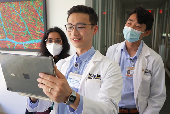 three medical students looking at ipad