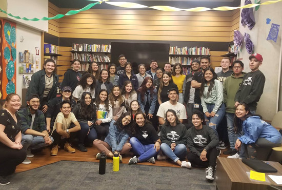 group of Latinx identifying students smiling together