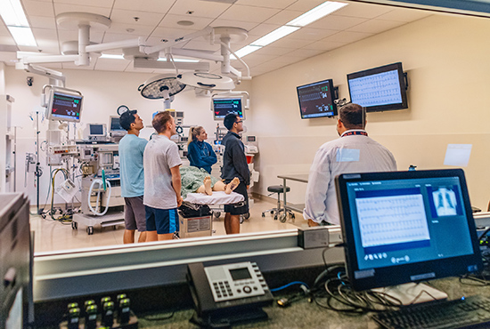Medical students conduct a training exercise in the Simulation Center.