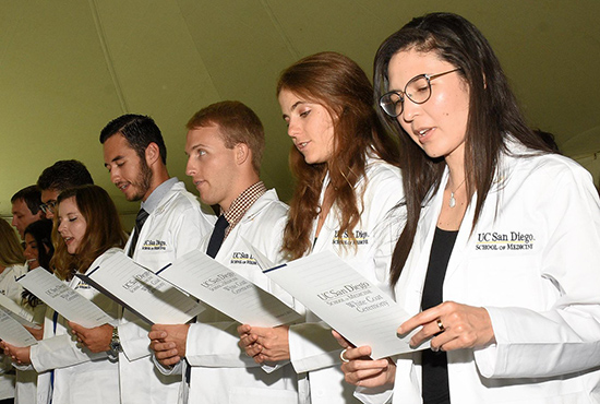 Medical students recite the Hippocratic Oath.