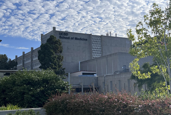 School of Medicine building blue sky with clouds