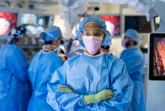 healthcare provider wearing scrubs and ppe in an operating room
