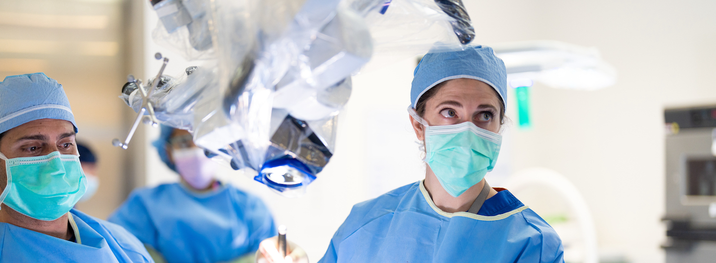 doctor in mask and scrubs in the operating room
