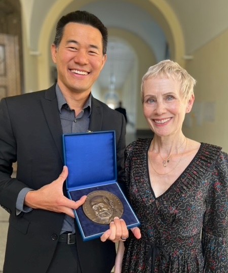 Eugene Yeo, PhD, MBA with Carla Brenner, daughter of Sydney Brenner, who presented the award
