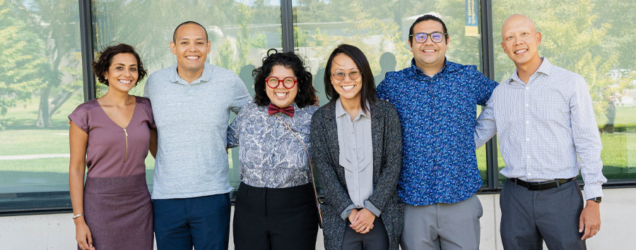 6 of 6, Group of 6 people smiling at camera standing outside